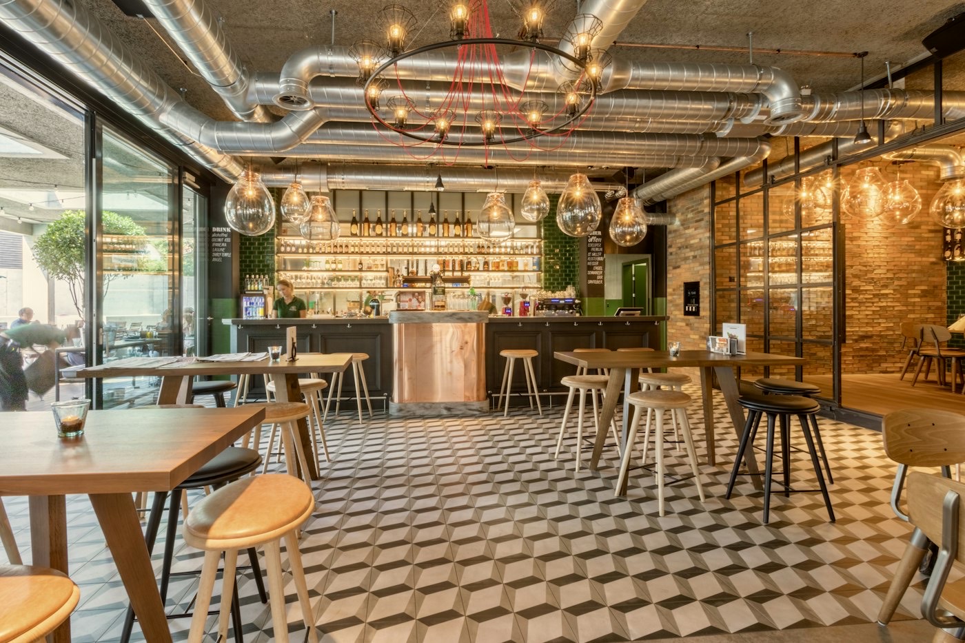 The dining room with wooden tables and pendant lights